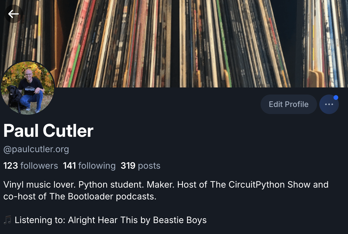 A screenshot of Paul's Bluesky profile showing: 🎵 Listening to: Alright Hear This by Beastie Boys